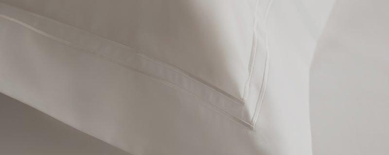 a close up of a man holding a piece of fabric