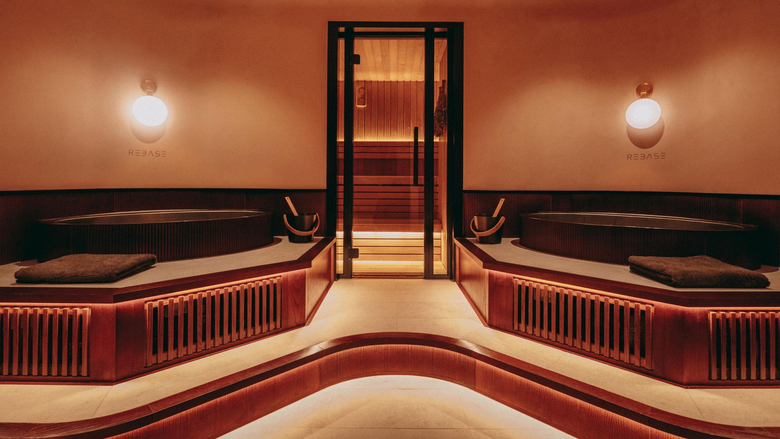a room with two large tubs and a large wooden bench