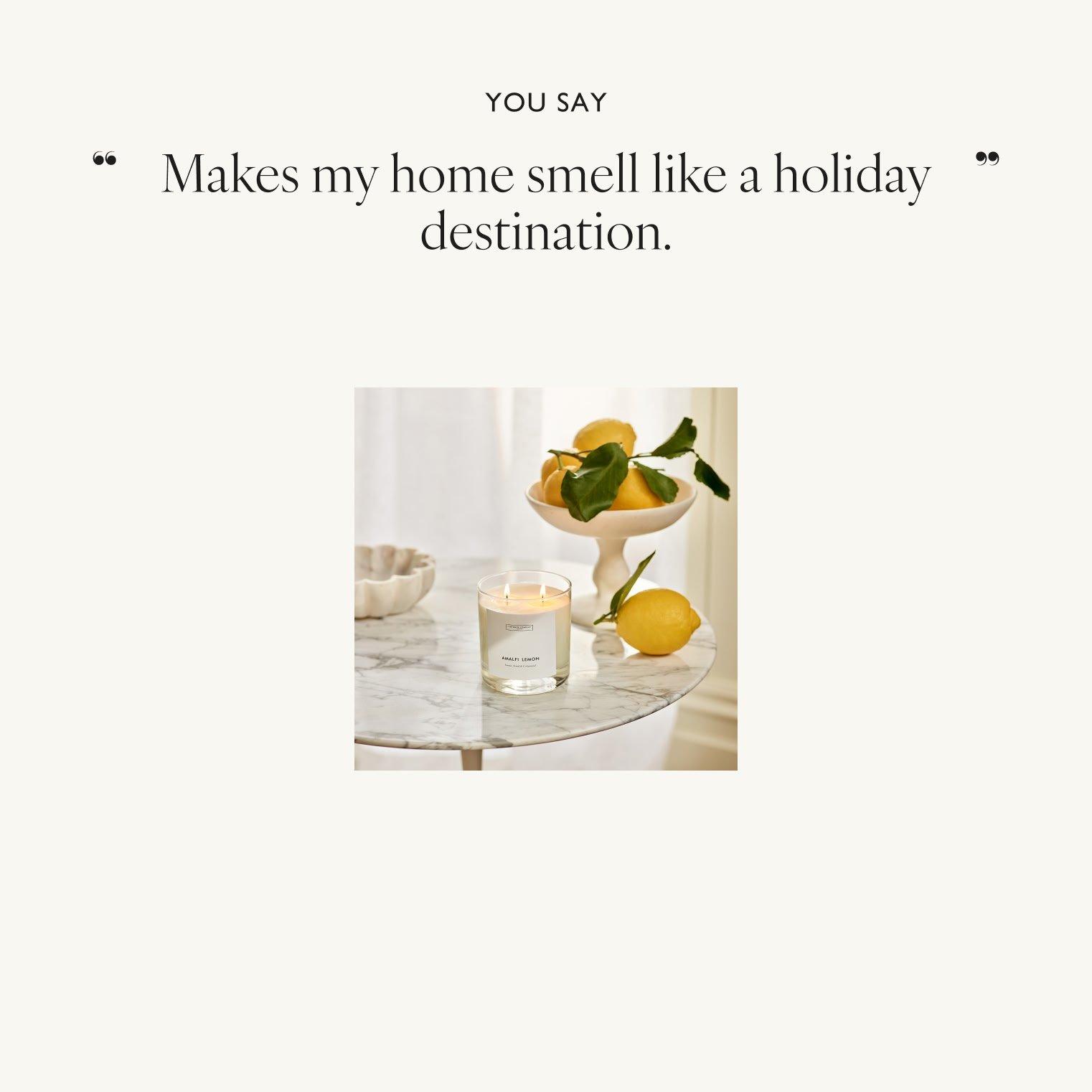a white table with a candle and lemons on it