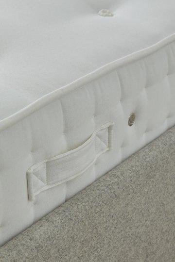a close up of a mattress with a zipper on the side