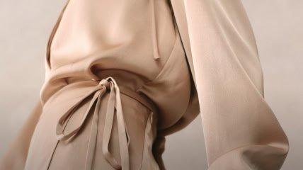 a white and black fabric with a pile of white beans